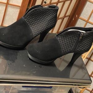 Bernie Mev black booties with woven side panels.